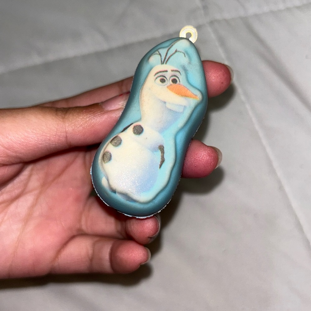 Small Olaf, squishy, pink stain on side, pencil, mark on back